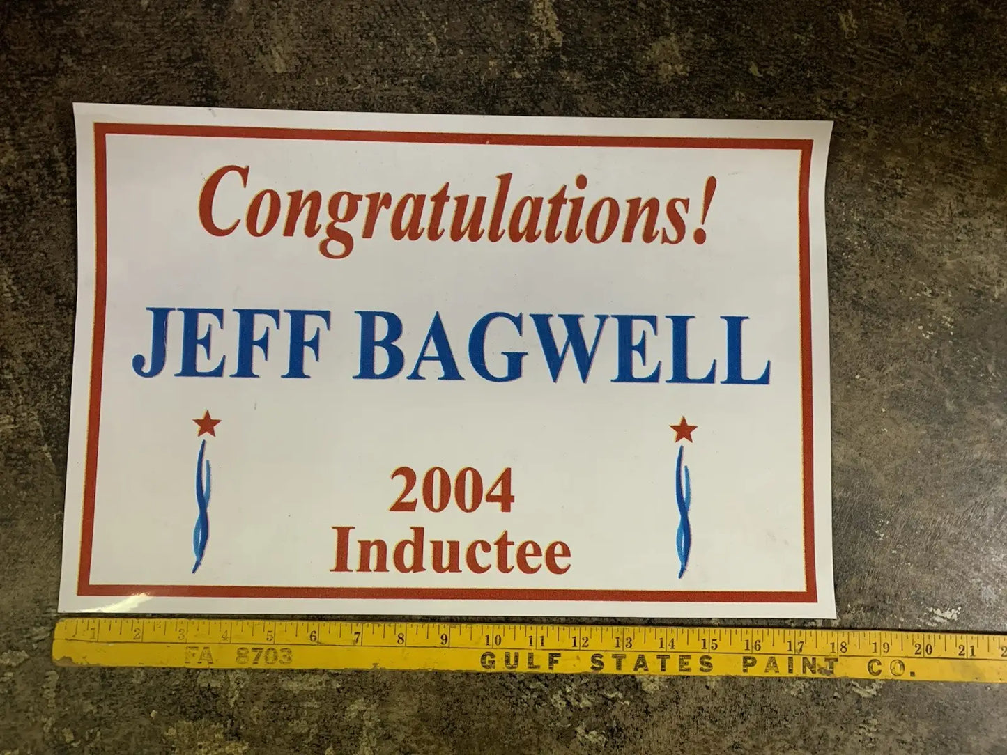 White rectangular sign with red border featuring Jeff Bagwell Texas Sports Hall of Fame