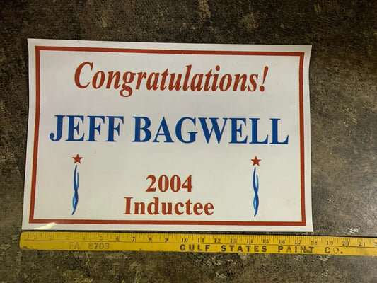 White rectangular sign with red border featuring Jeff Bagwell Texas Sports Hall of Fame