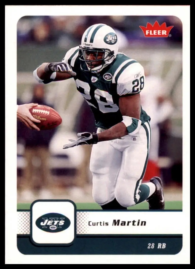 Green and white football player action figure with Fleer logo on a 2006 Fleer Curtis Martin football card