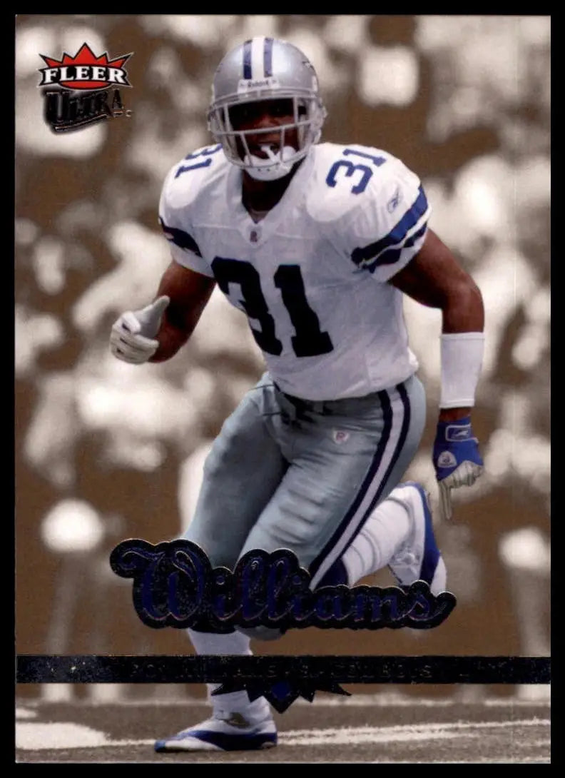 Dallas Cowboys football player action figure on 2006 Fleer Ultra Roy Williams football card