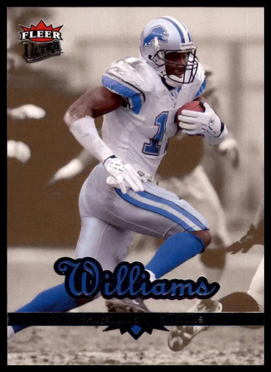 Football card featuring Roy Williams action figure in Lions uniform holding a football