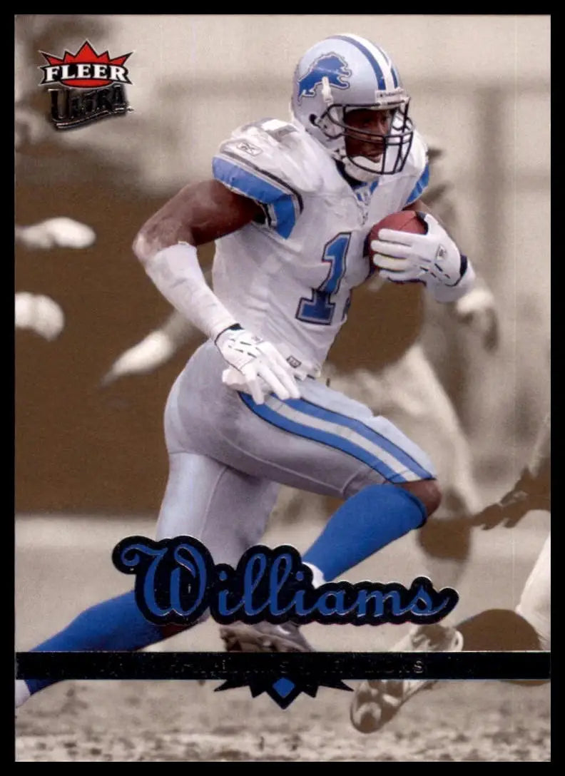 Football card featuring Roy Williams action figure in Lions uniform holding a football