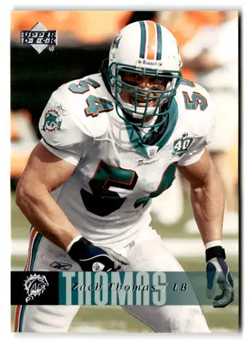 Original gloss football player in Miami Dolphins uniform featuring Zach Thomas from Upper Deck