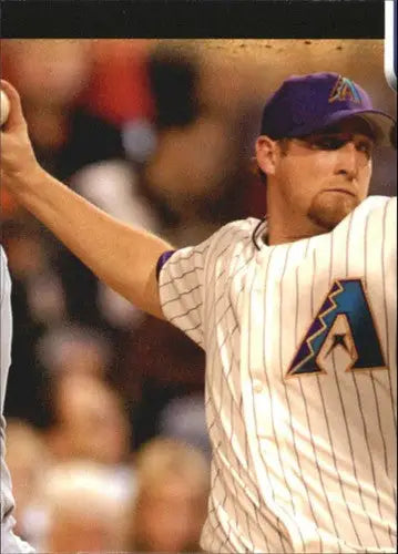 Baseball player in white pinstriped uniform with purple A logo pitching for Topps Opening Day