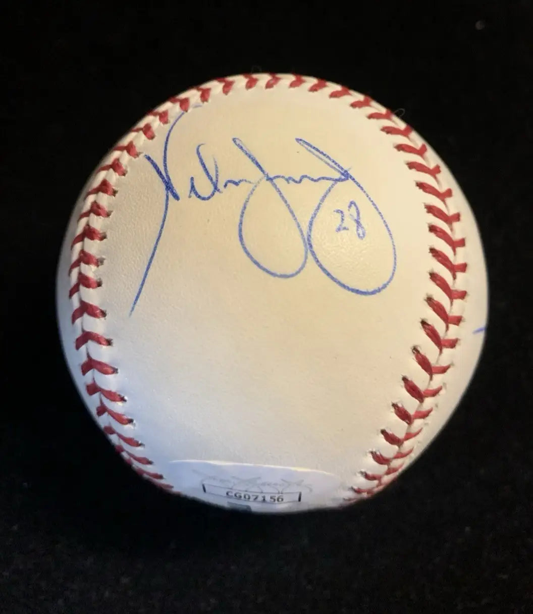 White Houston Astros baseball signed by Nelson Figueroa and Milo Hamilton with autograph and authentication sticker