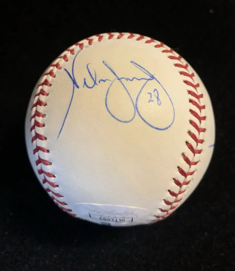 White Houston Astros baseball signed by Nelson Figueroa and Milo Hamilton with autograph and authentication sticker
