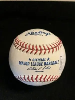 White baseball with red stitching from Houston Astros signed by Milo Hamilton and Henry Sosa