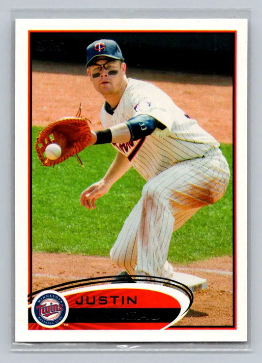 Baseball card of Justin Morneau from 2012 Topps #230b featuring the Minnesota Twins