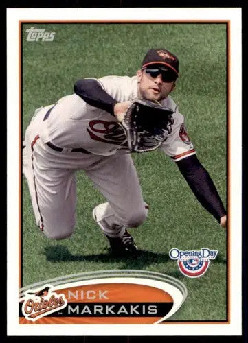 Original gloss baseball trading card featuring Nick Markakis of the Orioles in a fielding pose from Topps Opening Day 2012