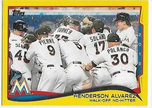 Baseball card showing Henderson Alvarez celebrating team with topps yellow finish and original gloss