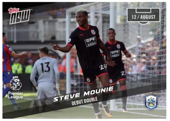 Soccer player in black uniform celebrating for Premier League debut double Steve Mounie