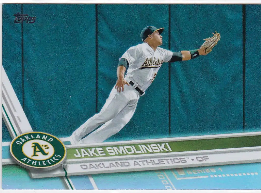 Baseball player diving to catch a ball in a Topps Rainbow Foil Jake Smolinski Oakland Athletics uniform