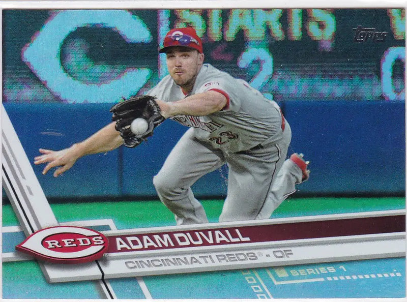 Baseball player Adam Duvall in Cincinnati Reds uniform catching a ball Topps Rainbow Foil