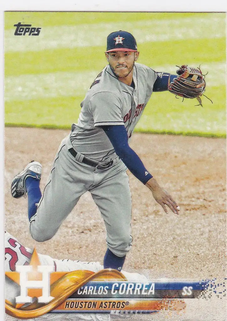 Baseball player in Houston Astros uniform mid-pitch for 2018 Topps Carlos Correa trading card