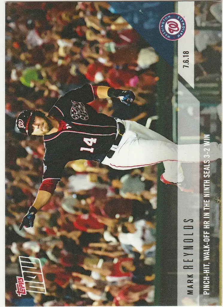 Baseball player in dark uniform swinging bat, capturing the ninth seals win Mark Reynolds