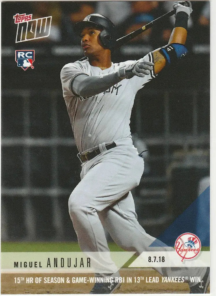 Baseball player Miguel Andujar in white uniform swinging bat for 15th HR of season