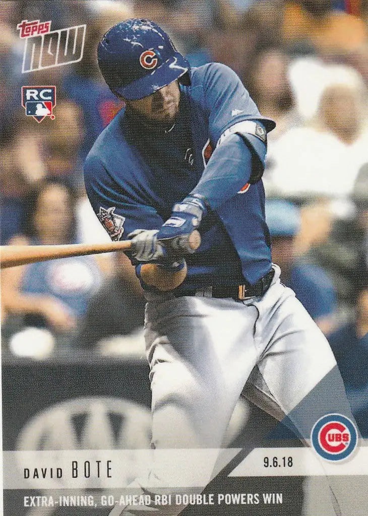 Baseball player David Bote in Chicago Cubs uniform swinging bat for go-ahead RBI double