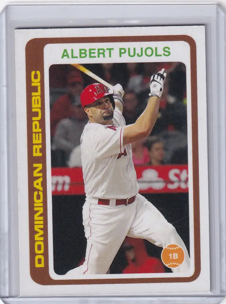 Baseball card of Albert Pujols swinging bat in white and red Los Angeles Angels uniform
