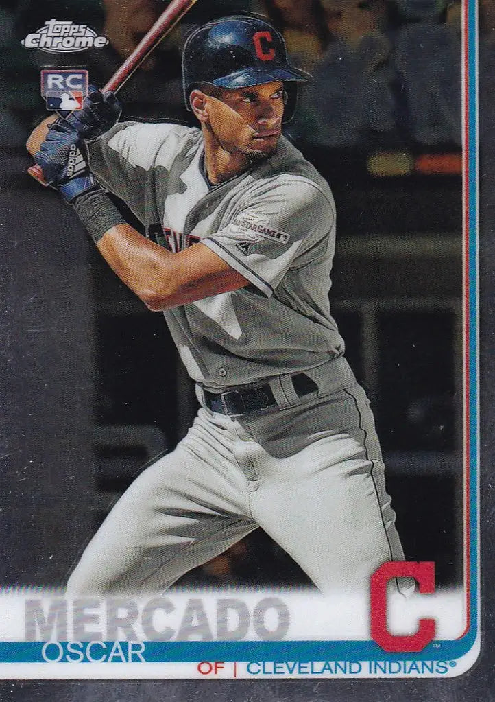 Baseball player in gray Cleveland Indians uniform holding bat for trading cards collection