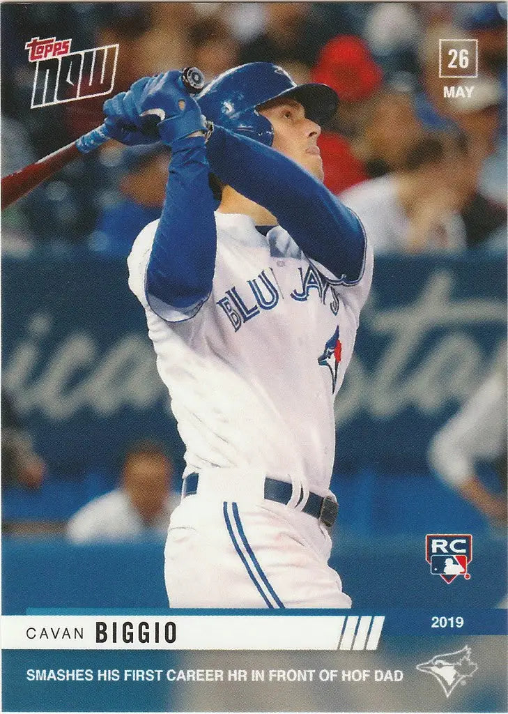 Baseball player Cavan Biggio in Blue Jays uniform swinging bat for first HR with HOF dad