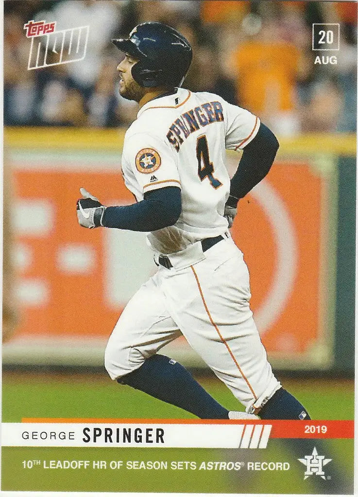 Baseball player in white Houston Astros uniform celebrating Springer 10th leadoff homer