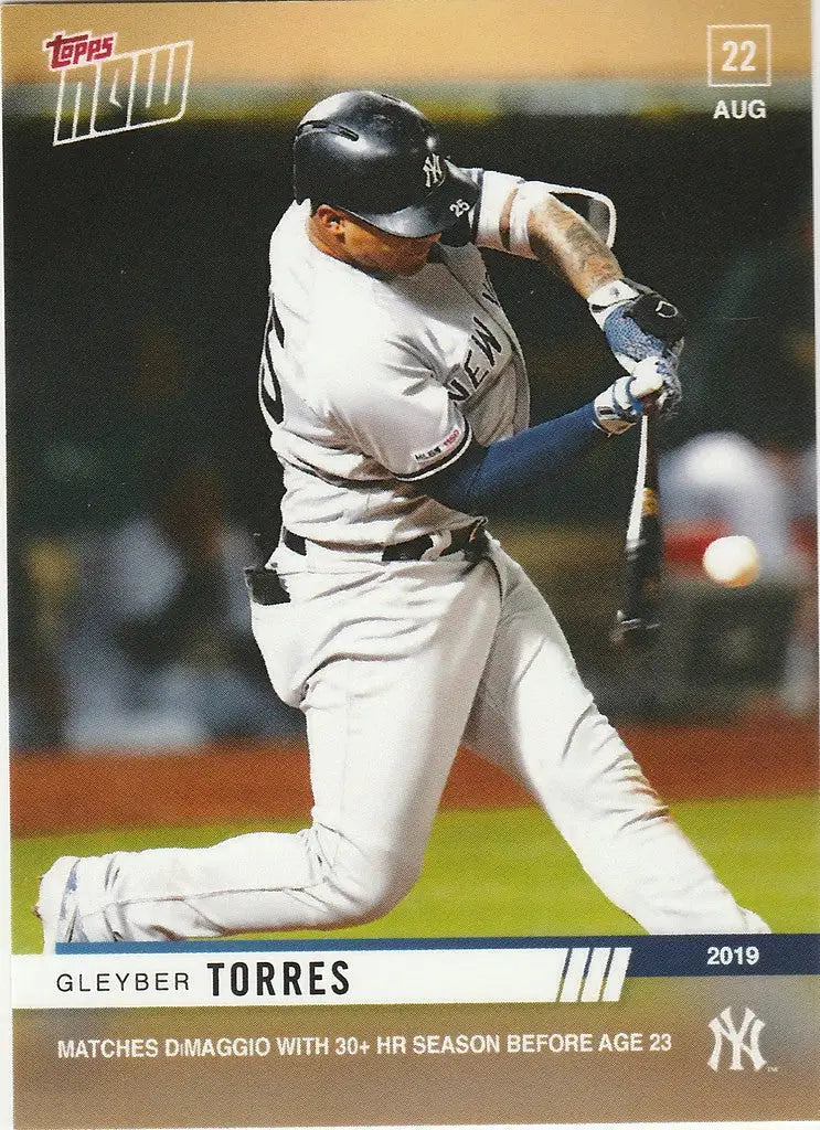 Baseball player Gleyber Torres swinging bat in New York Yankees uniform for 30th home run