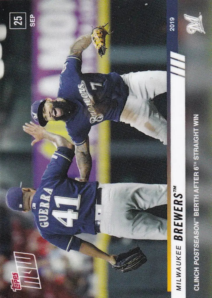 Baseball player sliding into base as another tries to tag in Milwaukee Brewers clinch postseason