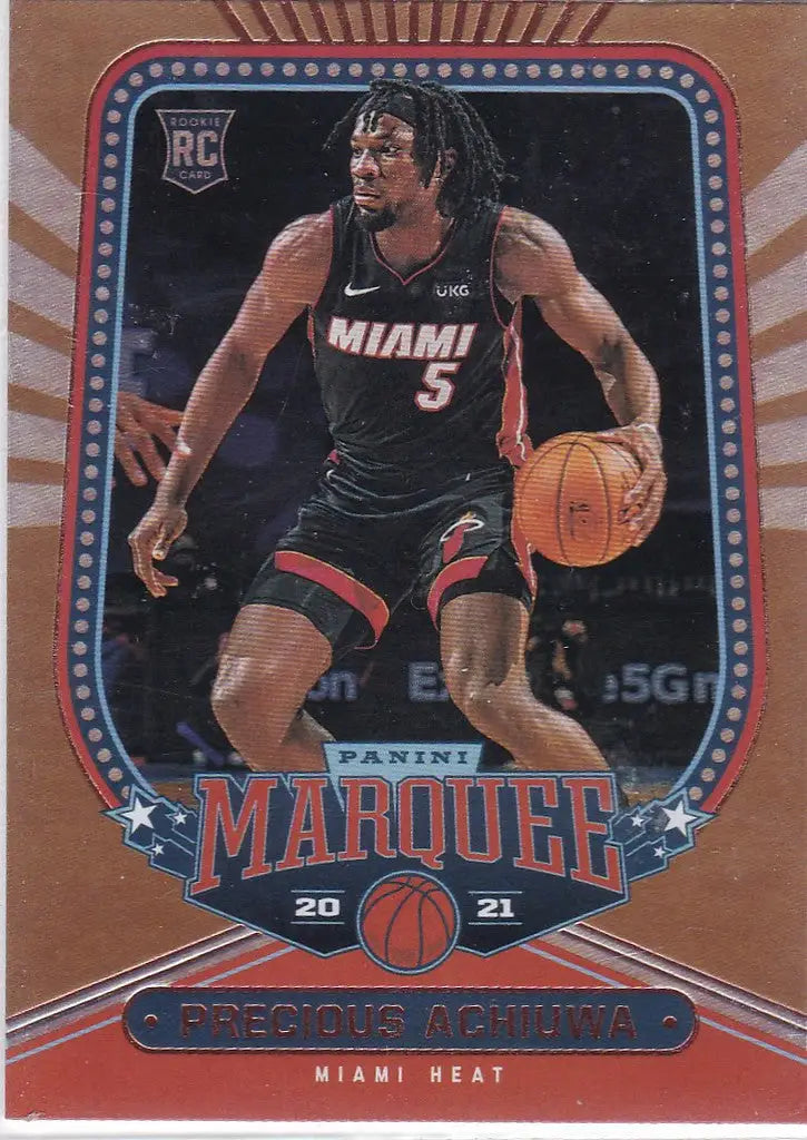 Basketball trading card of Precious Achiuwa dribbling for Miami Heat in black jersey