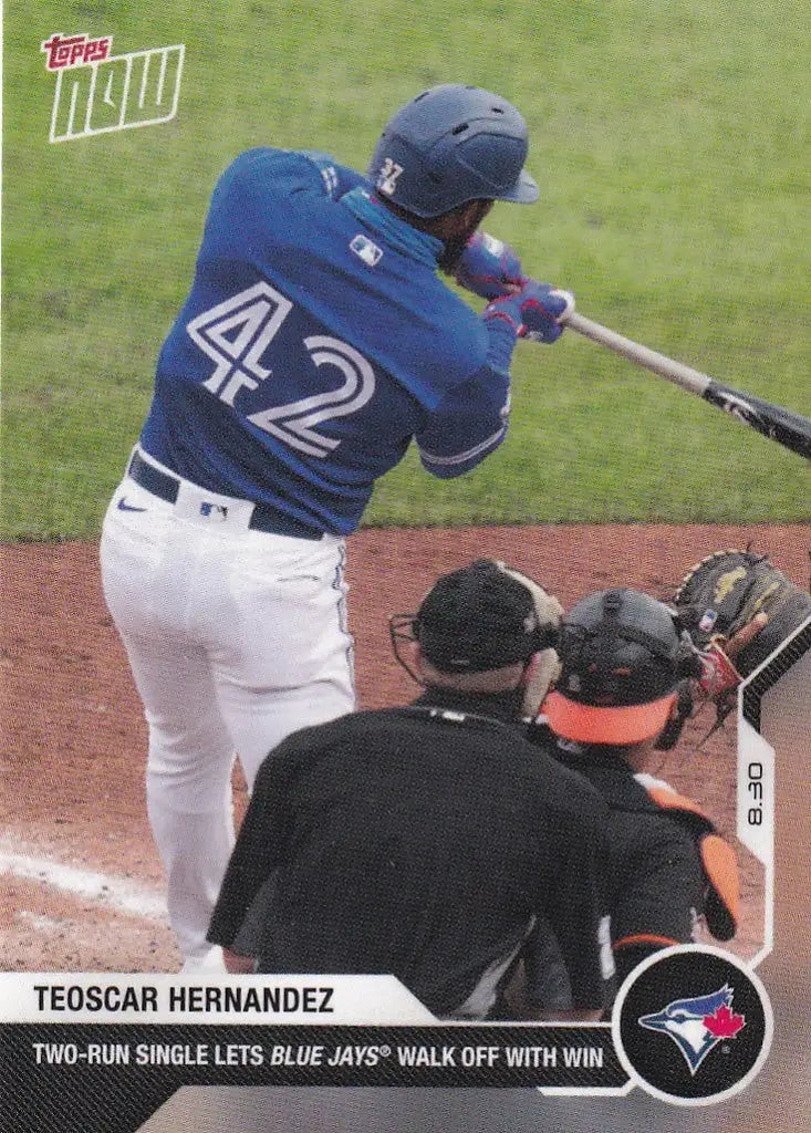 Teoscar Hernandez in blue Toronto Blue Jays uniform number 42 swinging bat