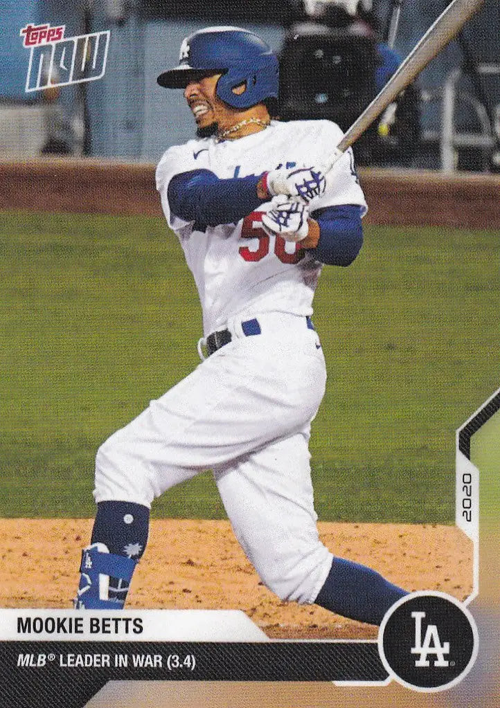 Mookie Betts Los Angeles Dodgers player swinging bat in white uniform