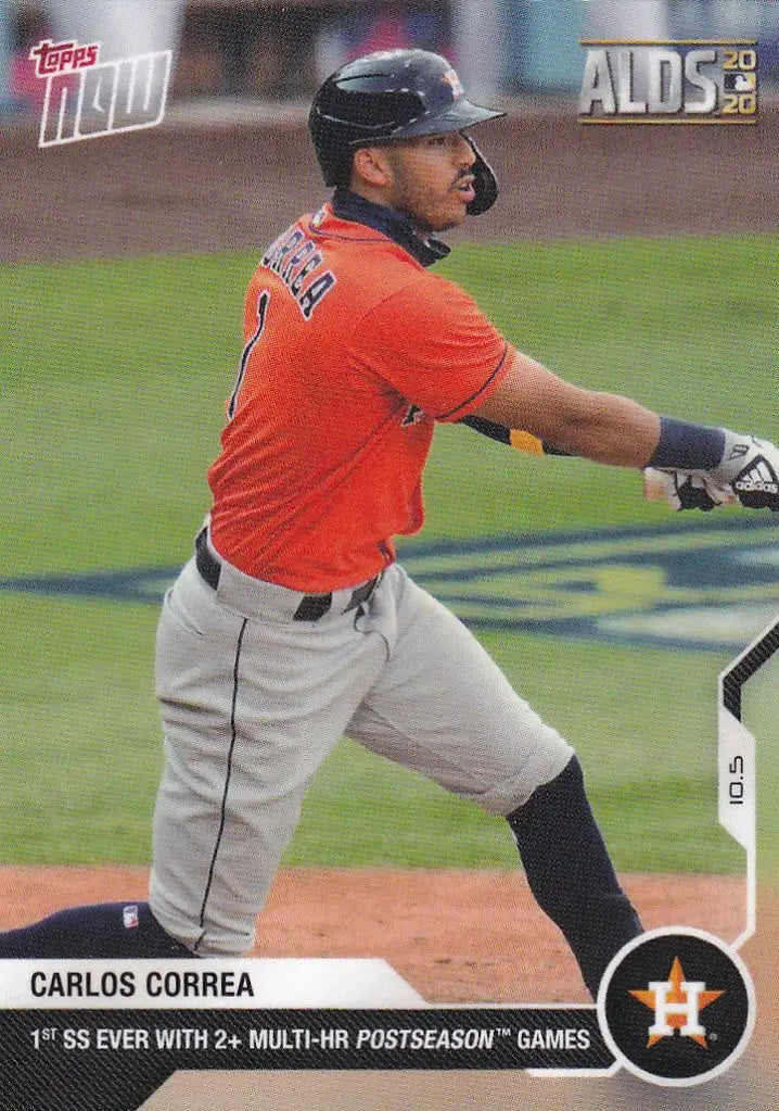 Baseball card of Carlos Correa Houston Astros player in orange jersey mid-swing