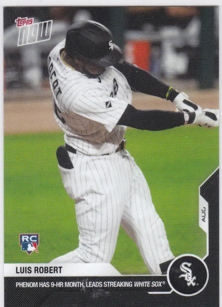Baseball player Luis Robert in Chicago White Sox pinstripe uniform swinging a bat