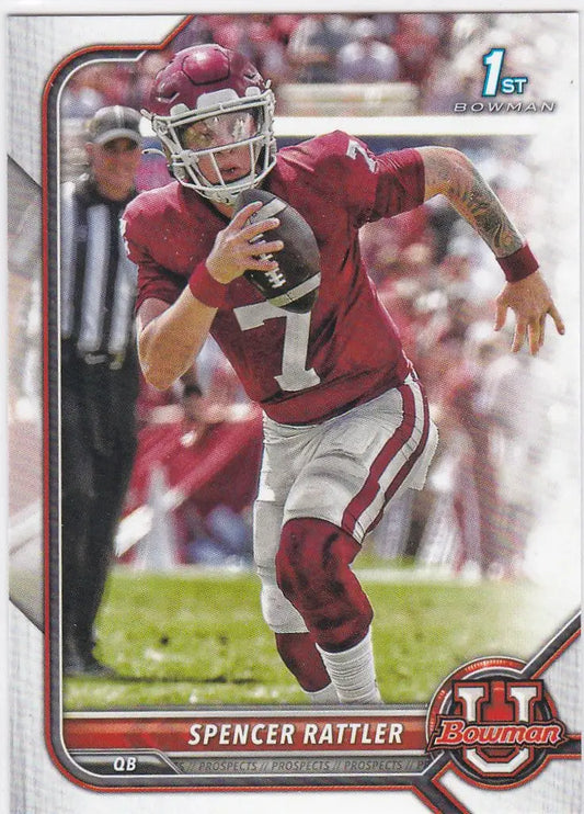 Football player in crimson jersey running with ball for Spencer Rattler South Carolina