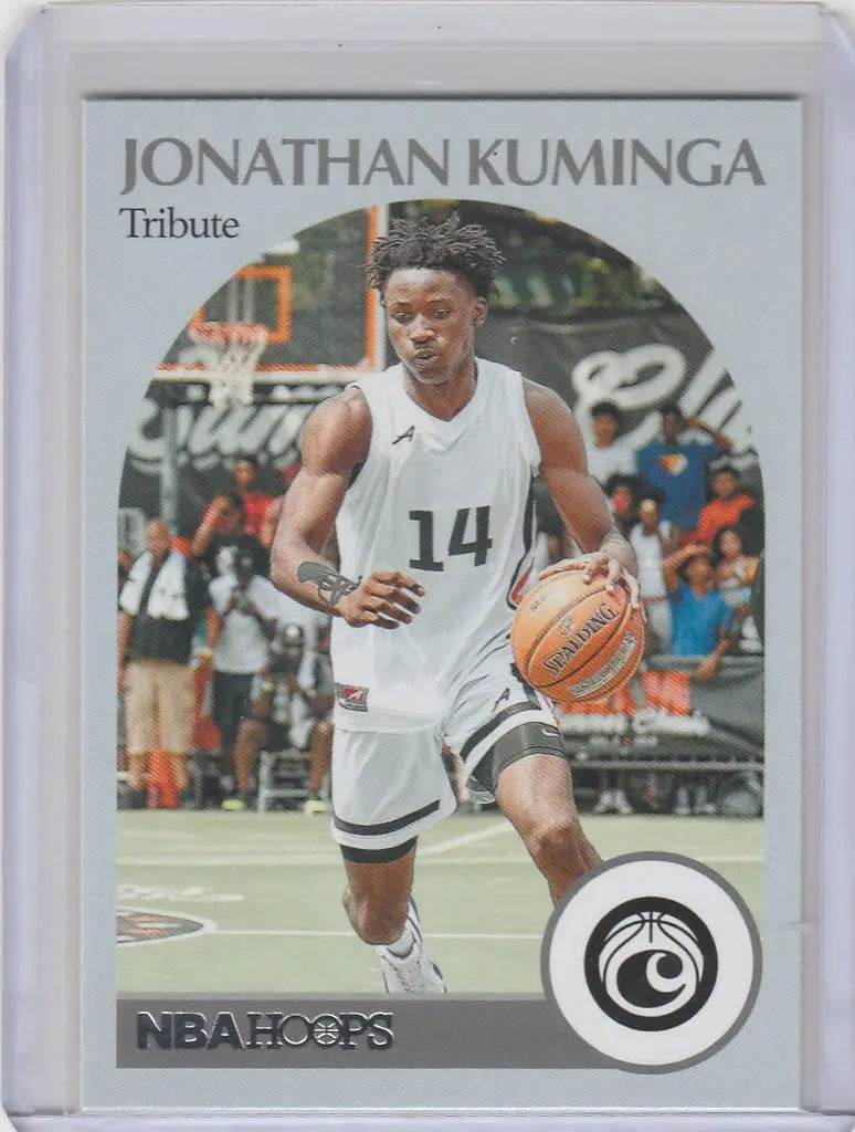 Basketball trading card of Jonathan Kuminga in white jersey dribbling ball, 2021-22 Chronicles Draft
