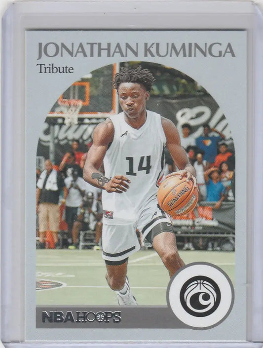 Basketball trading card of Jonathan Kuminga in white jersey dribbling ball, 2021-22 Chronicles Draft