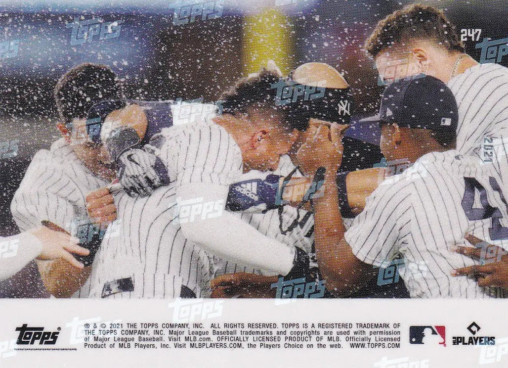 Baseball players celebrating a win featuring Gleyber Torres of the New York Yankees