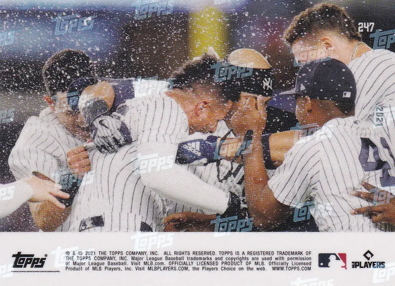 Baseball players celebrating a win featuring Gleyber Torres of the New York Yankees