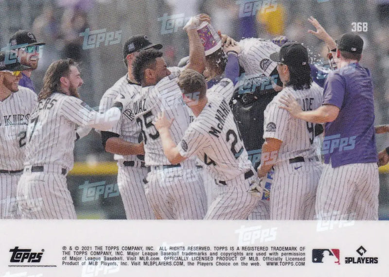 Baseball team celebrating a win featuring Charlie Blackmon and the Colorado Rockies