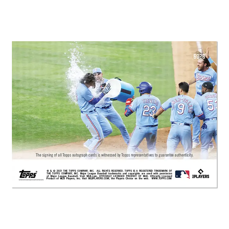Baseball players celebrating as Jonah Heim is doused with water at Texas Rangers field