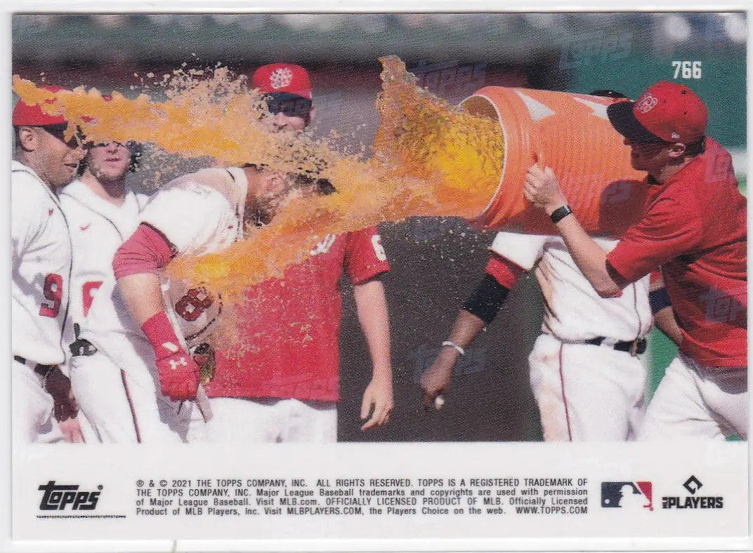 Baseball players giving a Gatorade bath featuring Carter Kieboom Washington Nationals during a game