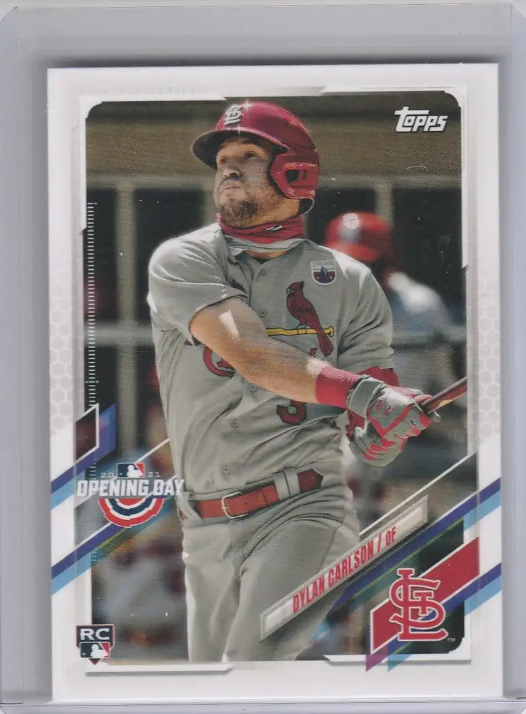 Baseball card of Dylan Carlson swinging bat for St. Louis Cardinals Topps Opening Day