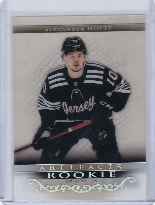 Hockey trading card of Alexander Holtz in dark jersey from Upper Deck Artifacts collection