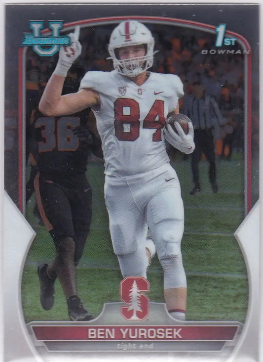 Football player in white uniform with number 84 running, showcasing Ben Yurosek Bowman 1st