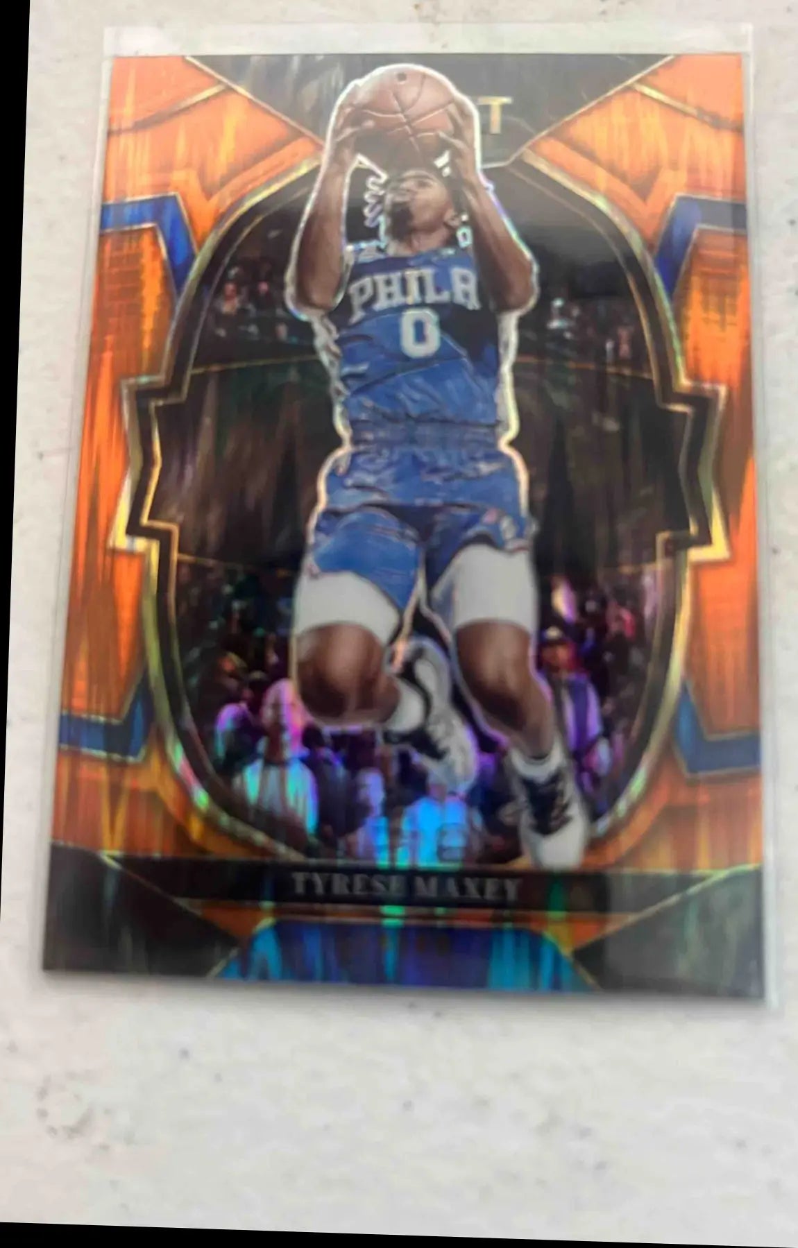 Panini Select Tyrese Maxey basketball trading card with orange border from 2022 collection