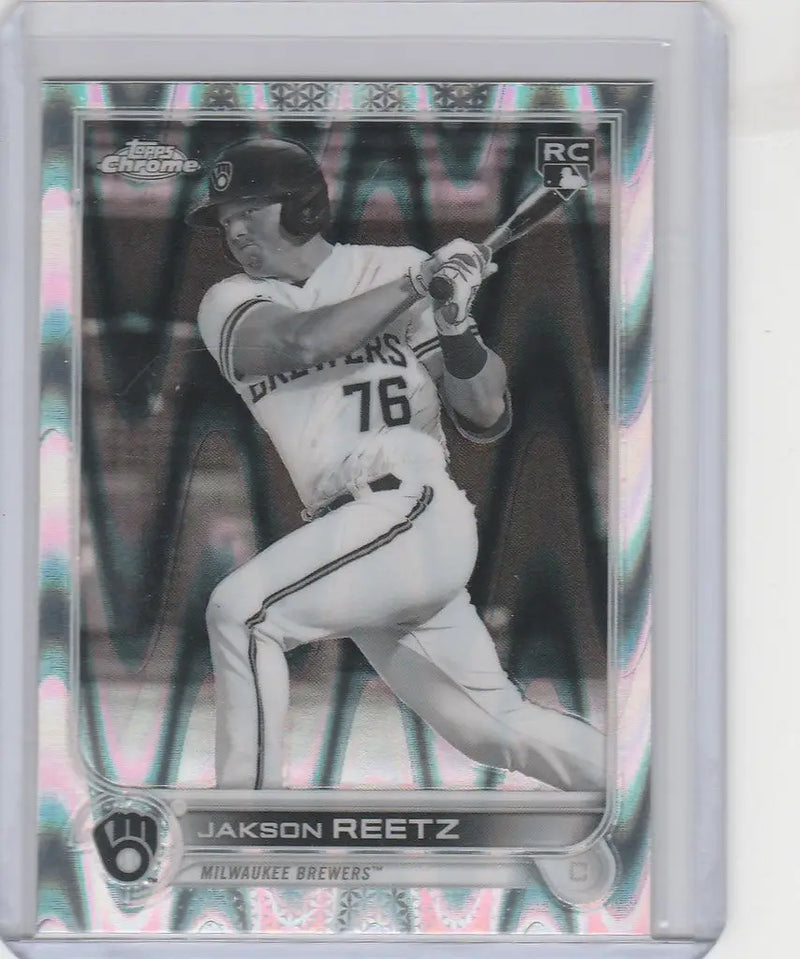 Baseball card of Jackson Reetz mid-swing in Topps Chrome Raywave for Milwaukee Brewers