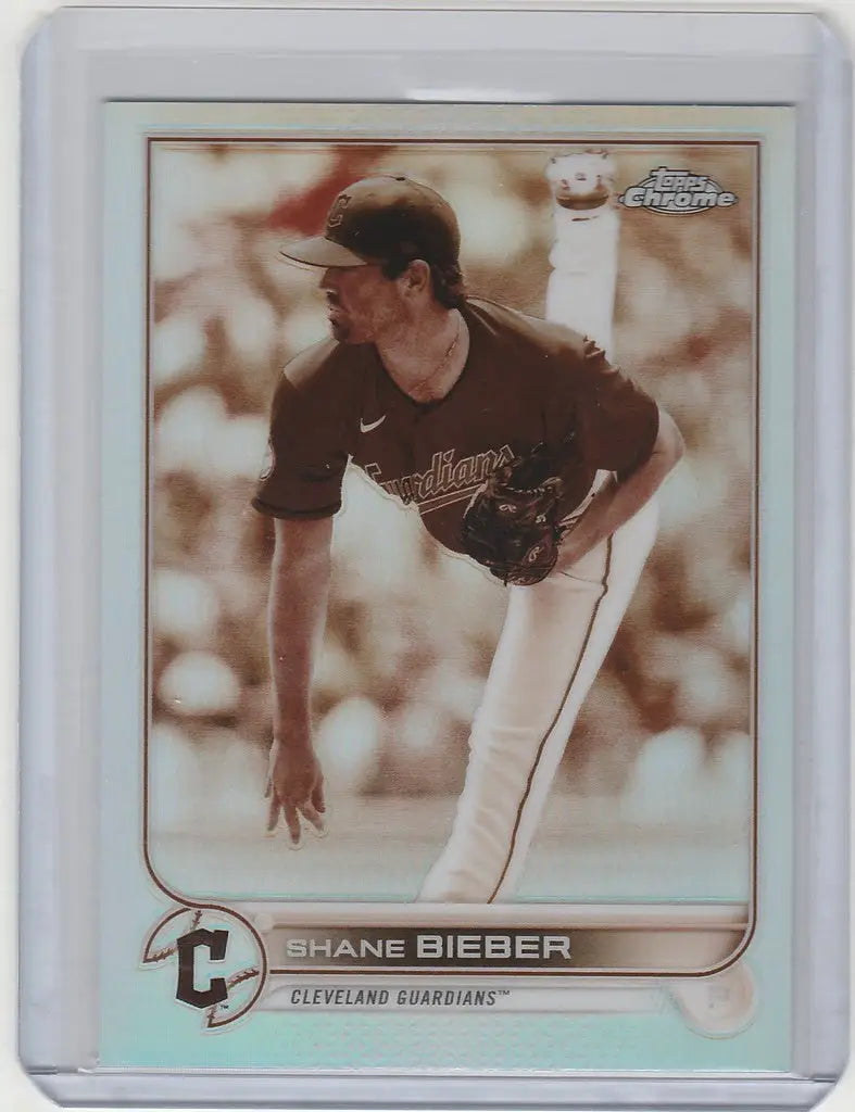 Baseball card of Shane Bieber pitching in dark uniform for Topps Chrome Sepia
