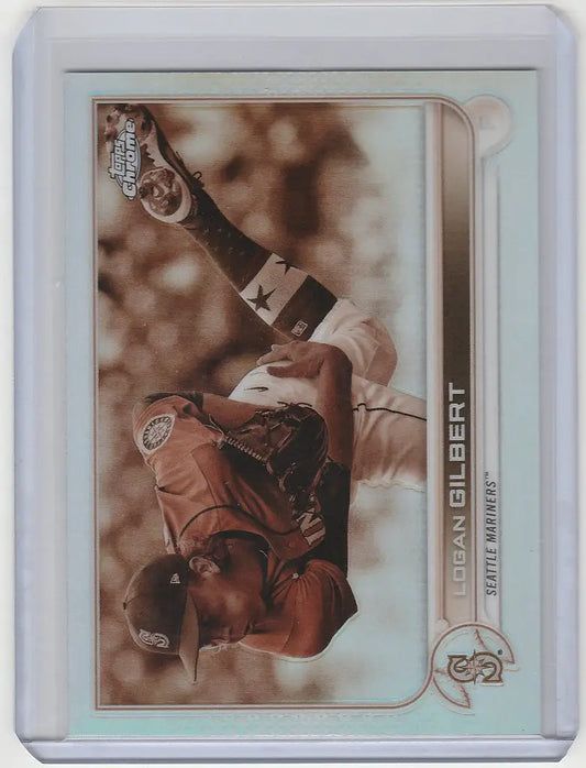 Baseball trading card of Logan Gilbert making a diving catch in Topps Chrome Sepia design