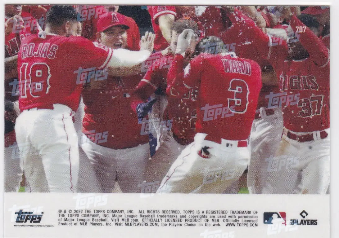 Baseball players celebrating with 2022 TOPPS NOW #707 TAYLOR WARD- ANGELS card