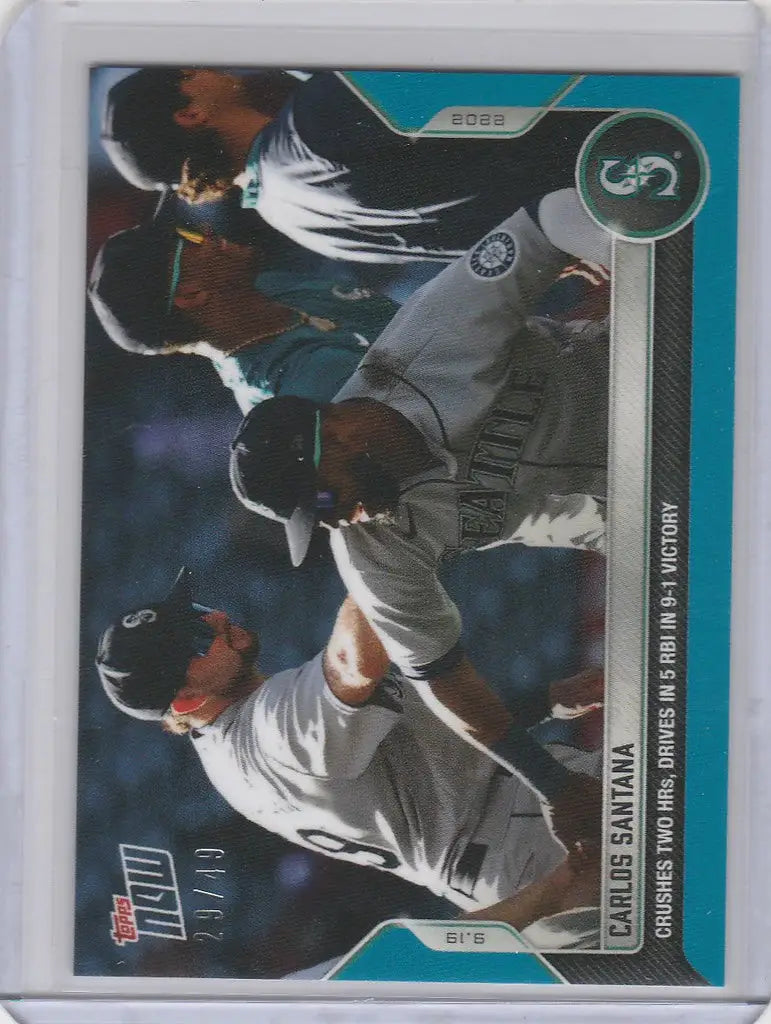 Baseball trading card of Carlos Santana Seattle Mariners swinging bat in white uniform