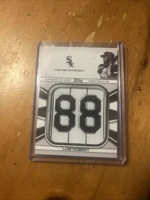 Luis Robert baseball card with jersey number medallion and medallion commemorative relics
